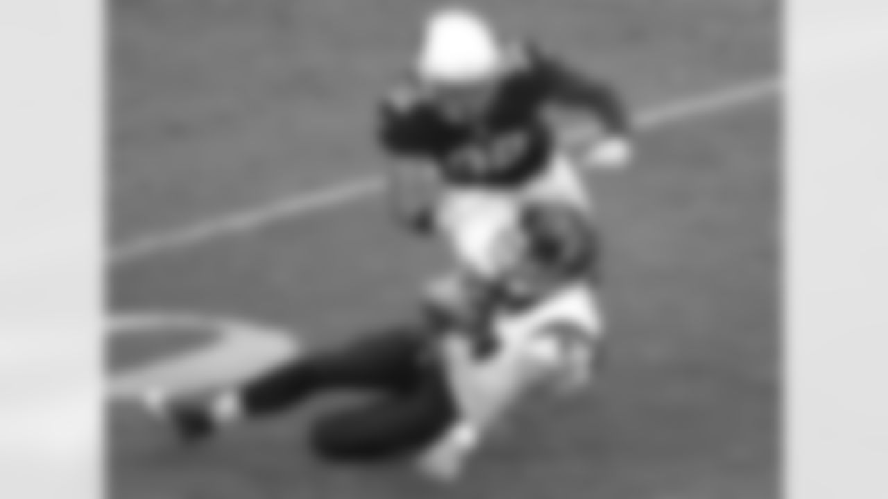 Texans QB Case Keenum slides as Cardinals S Tyrann Mathieu closes in.