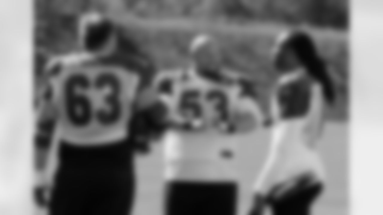 Centers Lyle Sendlein (left) and A.Q. Shipley (middle) talk with WR Larry Fitzgerald