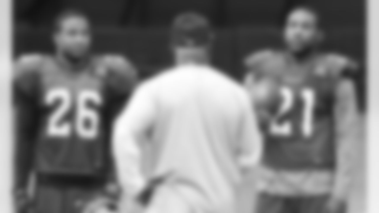 S Rashad Johnson (left) and CB Patrick Peterson talk to coach Kevin Ross