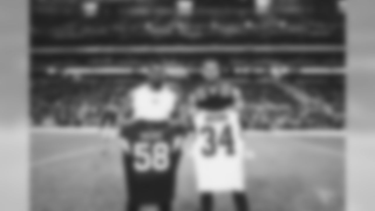 LB Jordan Hicks with Rams RB Malcolm Brown