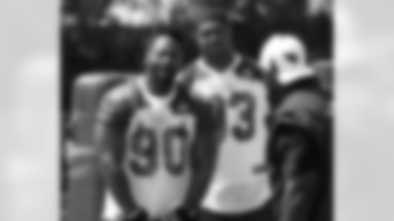 Birthday boy Darnell Dockett has a laugh with DE Calais Campbell and the rest of the defensive line