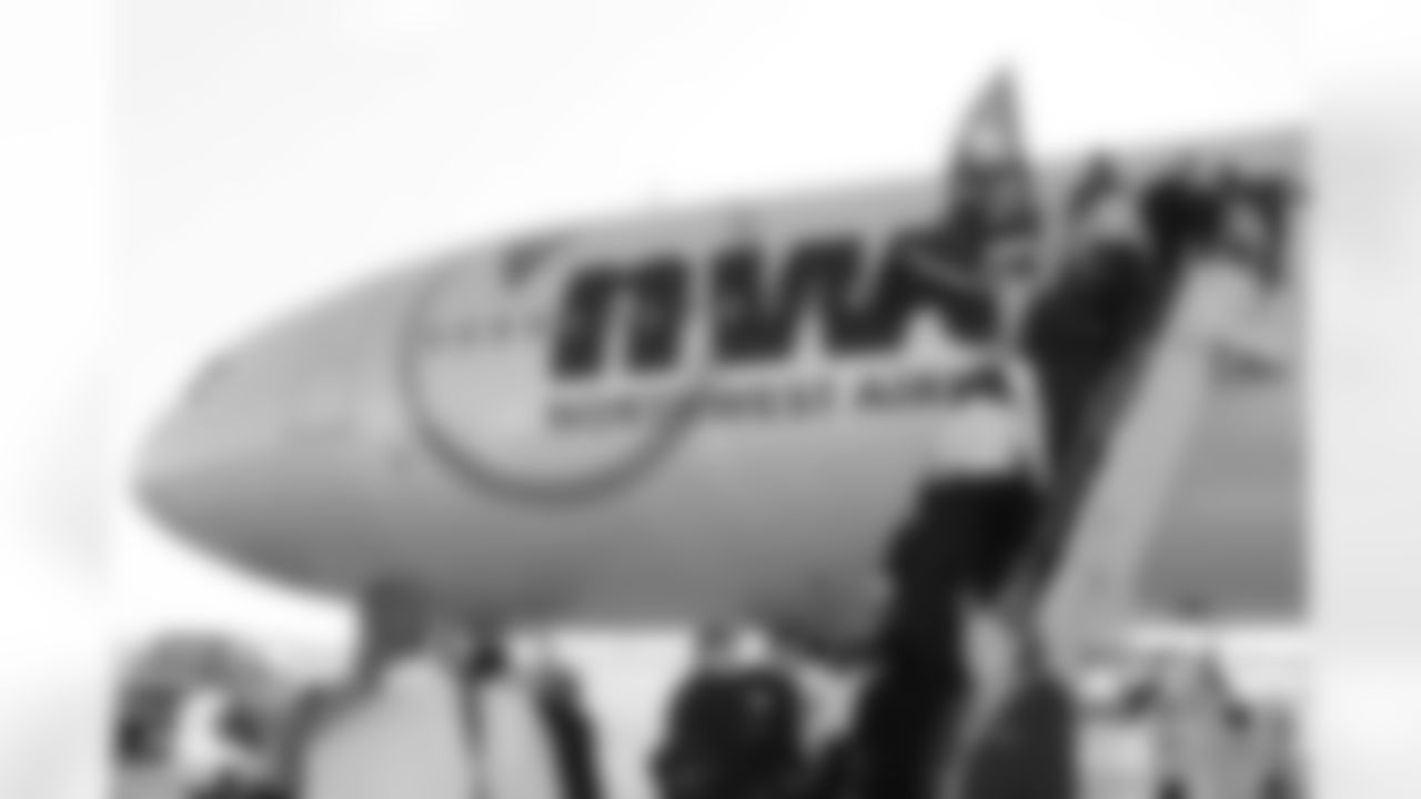 The team boards the flight