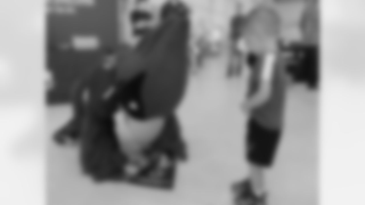 Big Red signs an autograph for a youngster