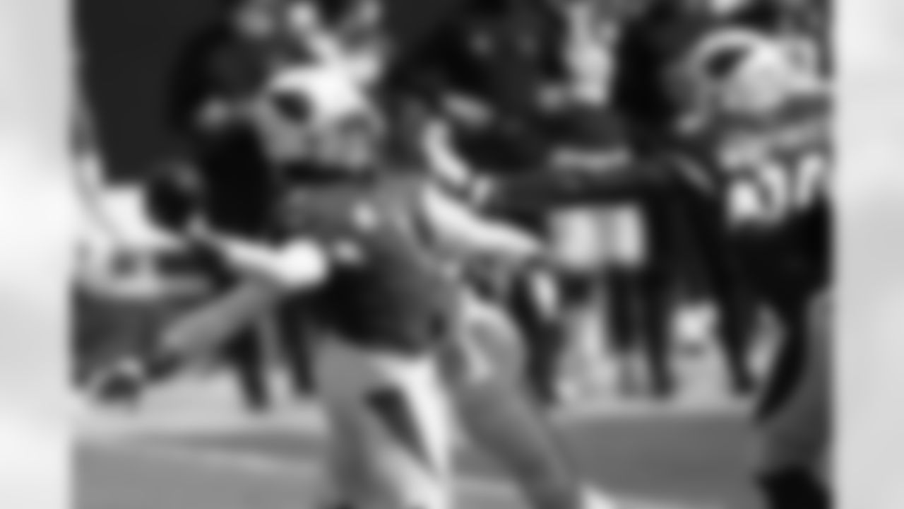 QB Kyler Murray passes under pressure during the first half.