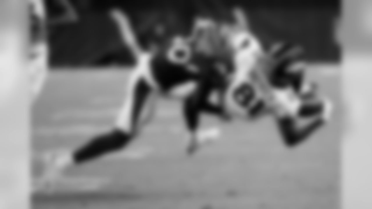 Broncos wide receiver Tim Patrick catches a pass under pressure from Cardinals defensive back Rudy Ford.