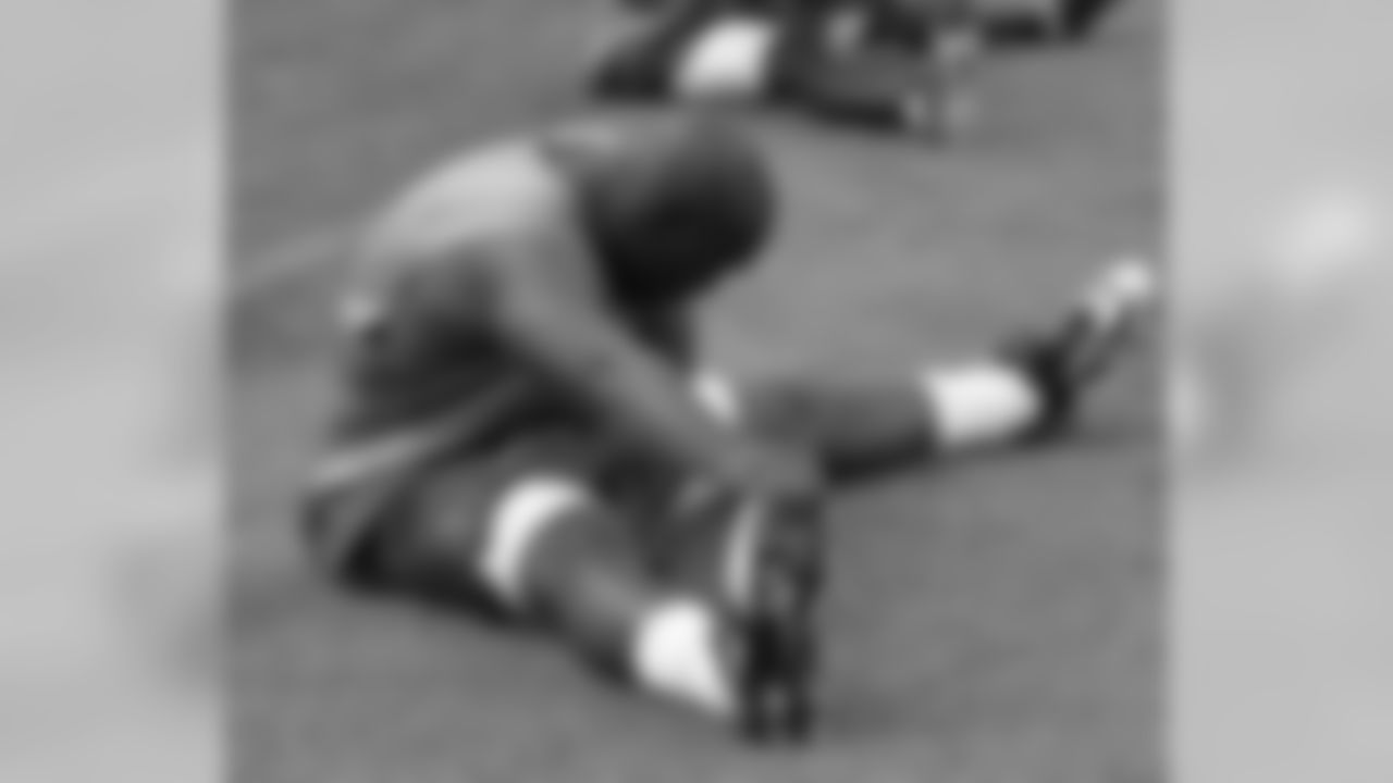 RB J.J. Arrington stretches prior to Run Test