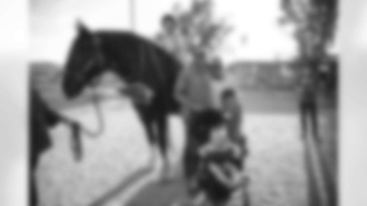 The Arizona Cardinals visit Hunkapi Farms to work with therapy horses and families with ALS on Saturday, May 13, 2023 in Scottsdale, AZ.