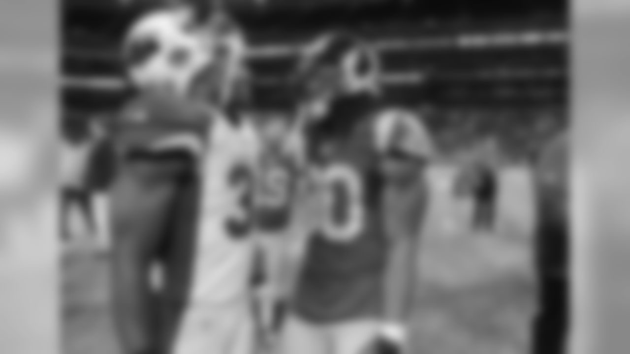 Johnson with Rams star rookie RB Todd Gurley in St. Louis