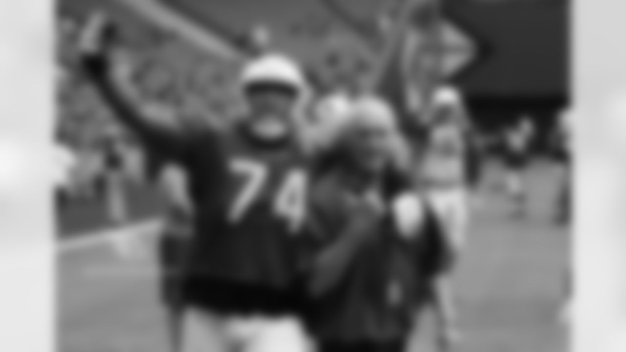 T D.J. Humphries and assistant offensive line coach Larry Zierlein