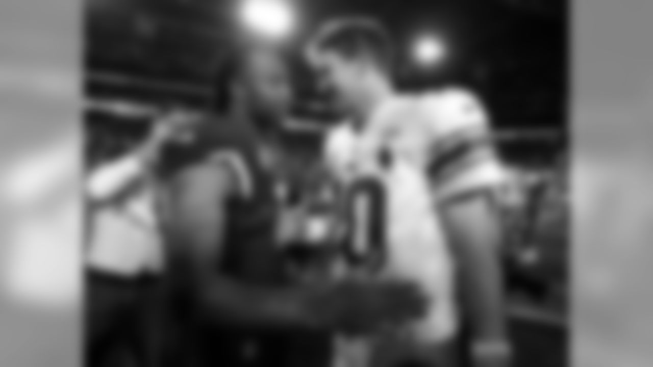 Larry Fitzgerald (left) and Eli Manning (right) meet after the game