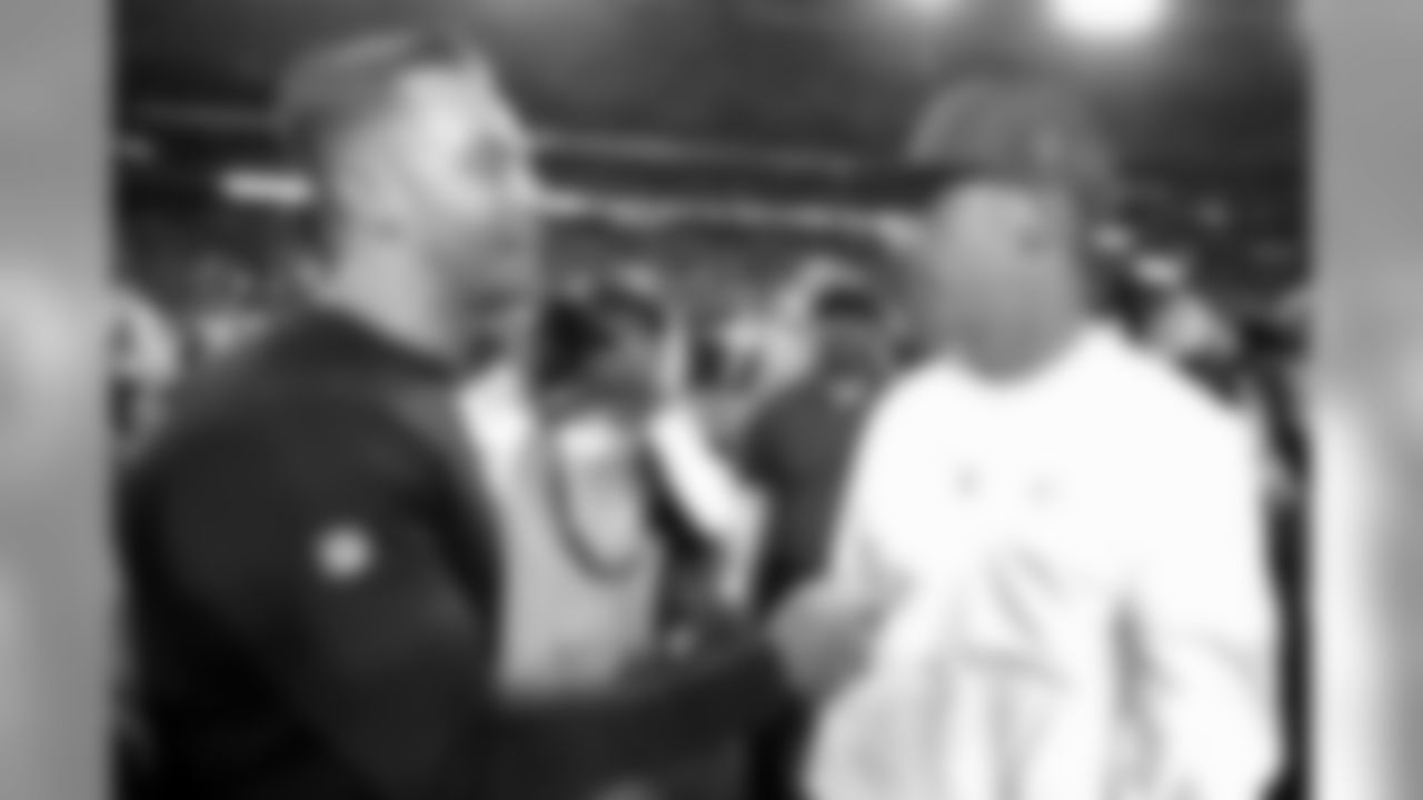 Cardinals head coach Kliff Kingsbury (left) greets San Francisco 49ers head coach Kyle Shanahan after an NFL football game on Halloween in Glendale, Ariz. The 49ers won 28-25.
