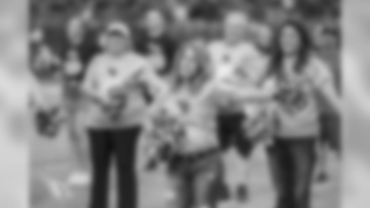 Images from halftime of the Falcons game, where Cardinals cheerleaders performed with cancer survivors and their caregivers to raise awareness for early detection and prevention