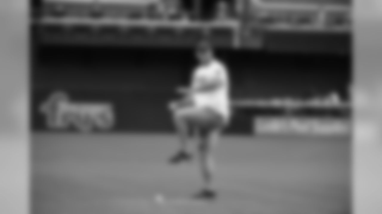 T Jared Veldheer unleashes his ceremonial first pitch