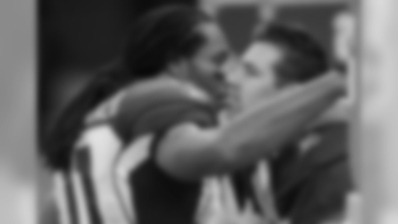 WR Larry Fitzgerald gives Warner a hug after the playoff loss to the Saints in 2010