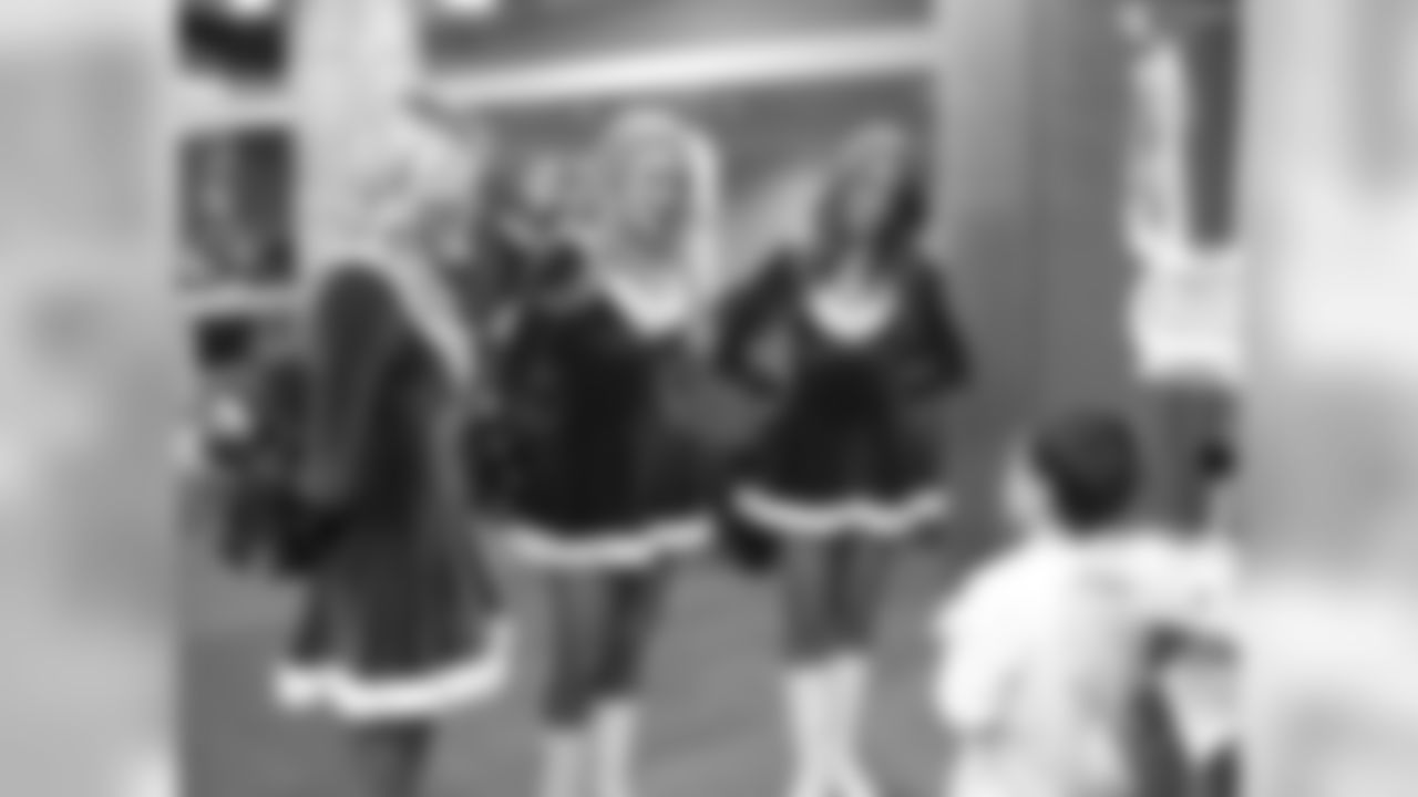 The cheerleaders speak with a patient