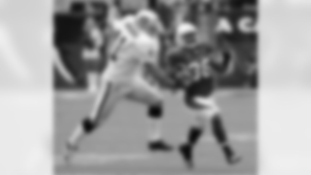 Returner LaRod Stephens-Howling gets around Raiders K Sebastin Janikowski in 2010