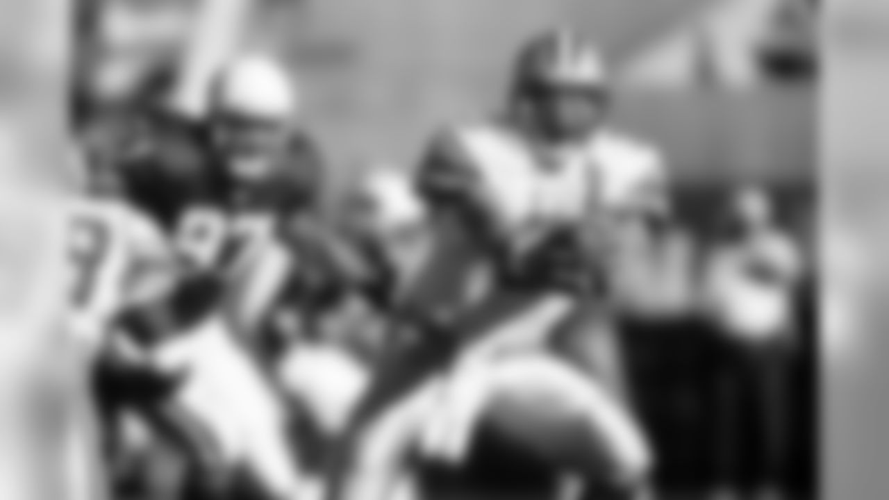 2002: Lions QB Joey Harrington fakes a handoff