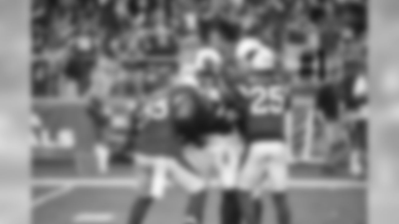 Josh Bynes is congratulated after his interception