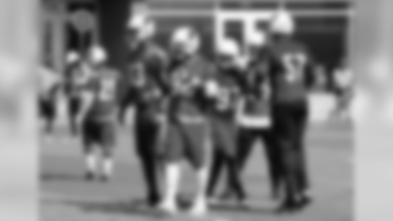 The defensive line breaks the huddle