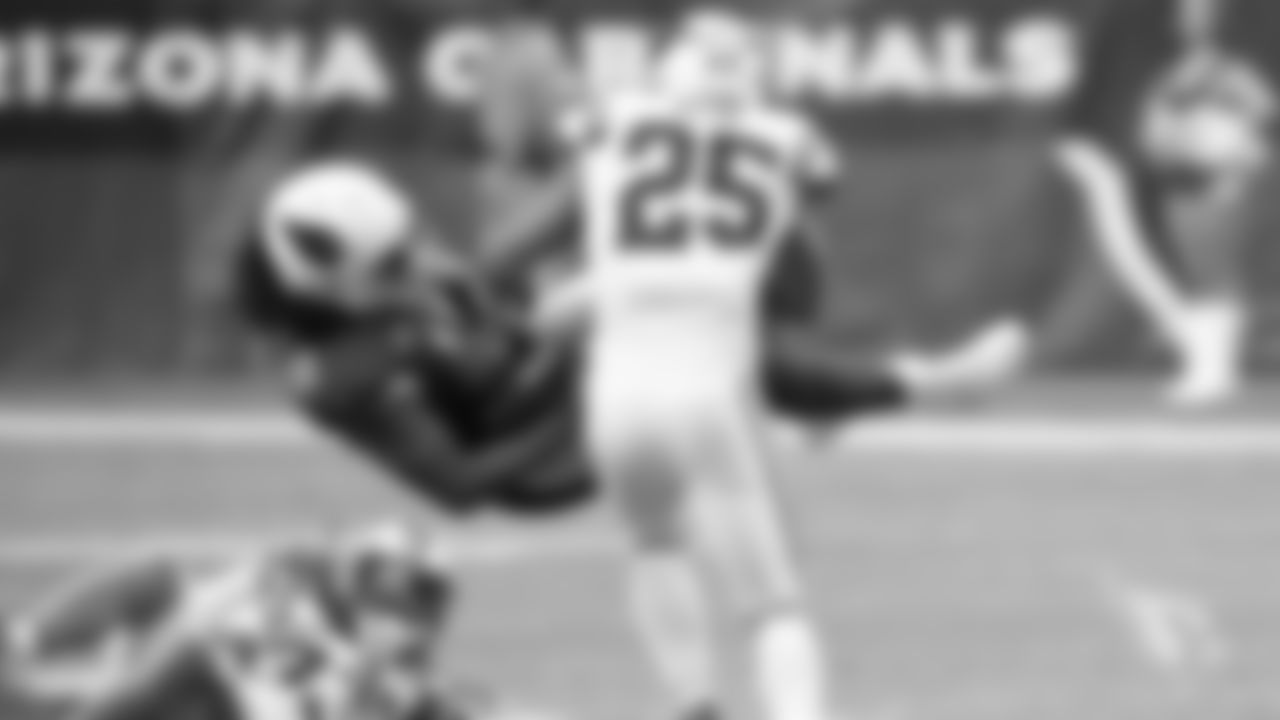 1. WR Larry Fitzgerald holds onto the pass after a big hit