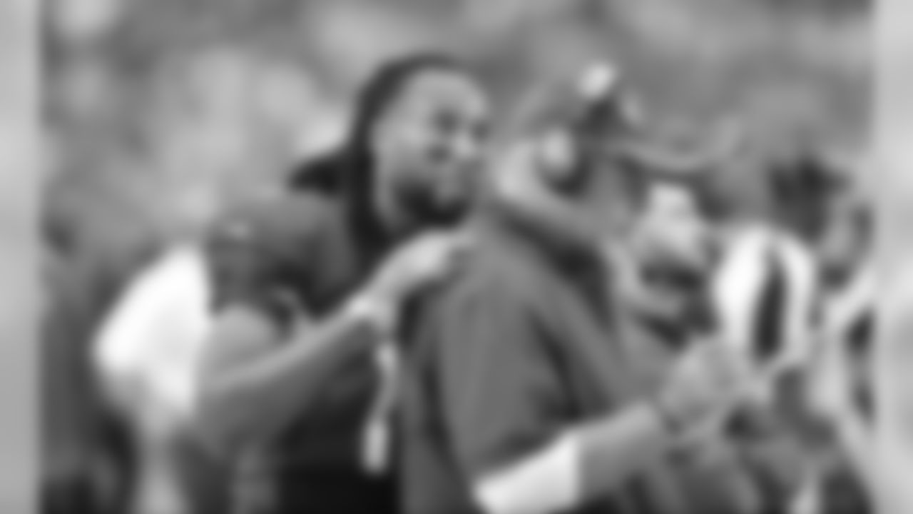 WR Larry Fitzgerald speaks with coach Bruce Arians during the Redskins game
