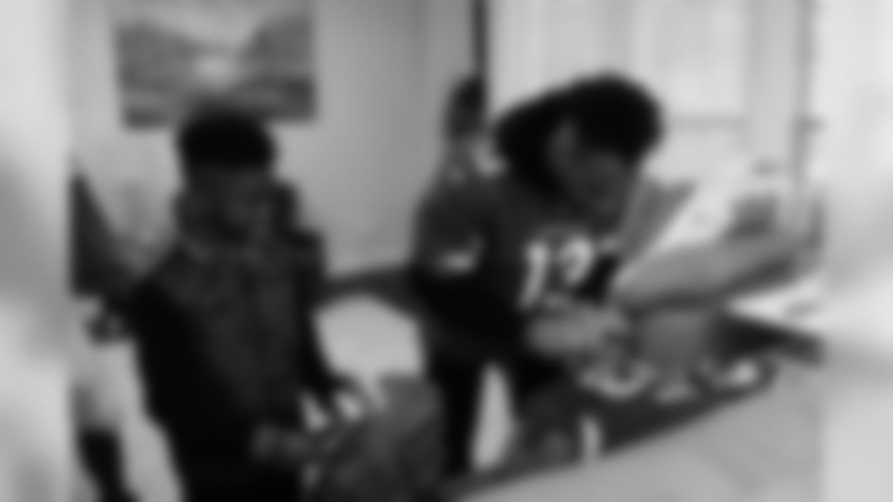 Images of Cardinals receiver Christian Kirk delivering surprise Super Bowl tickets to Devin Manigo at his home in Texas