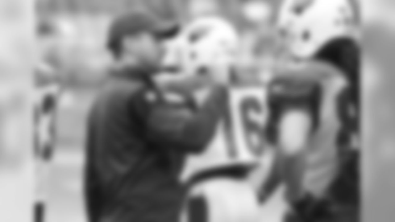 Assistant WR coach Kevin Garver explains something to WR Krishawn Hogan