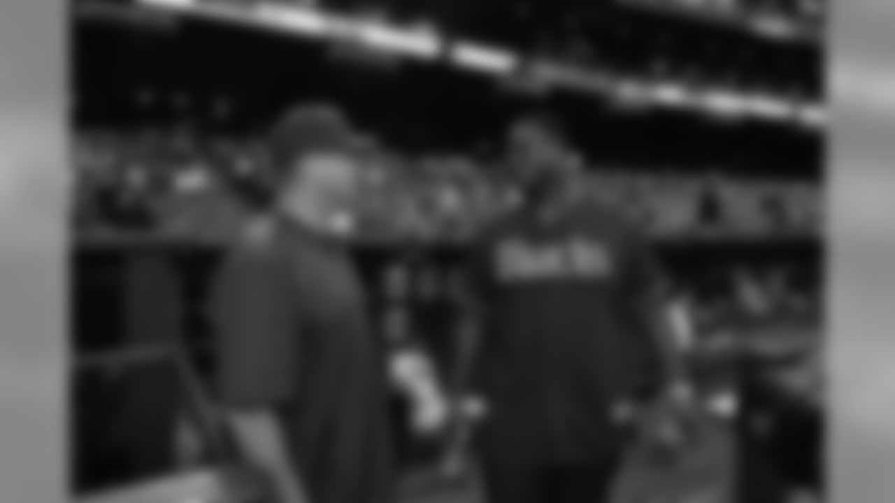 T D.J. Humphries talks with D-Backs assistant hitting coach Mark Grace