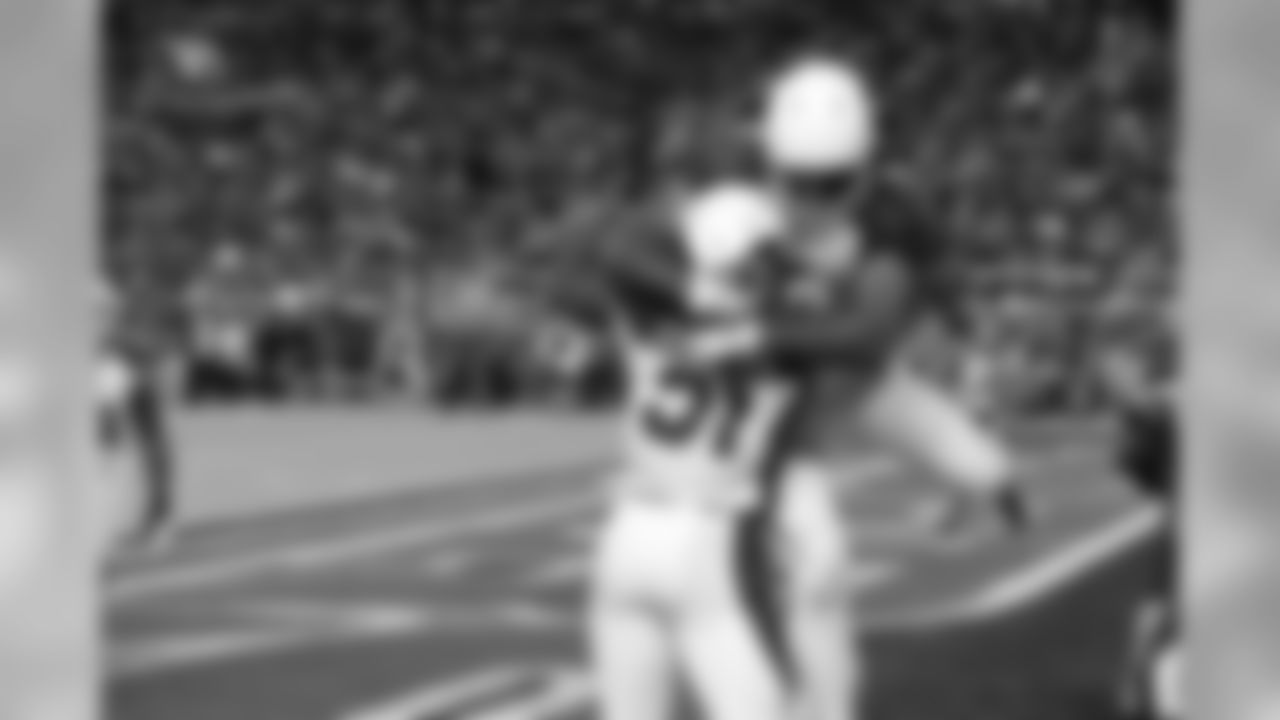 A joyous Larry Fitzgerald hugs RB David Johnson after a touchdown against the 49ers