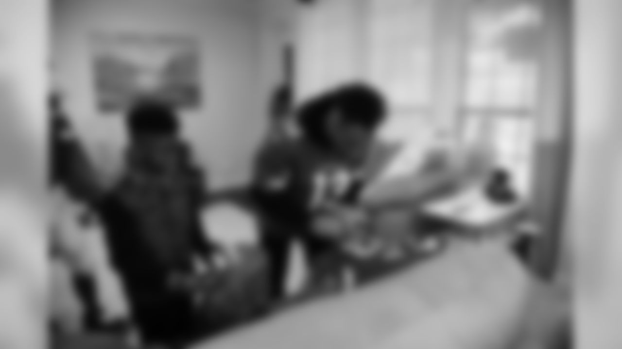 Images of Cardinals receiver Christian Kirk delivering surprise Super Bowl tickets to Devin Manigo at his home in Texas