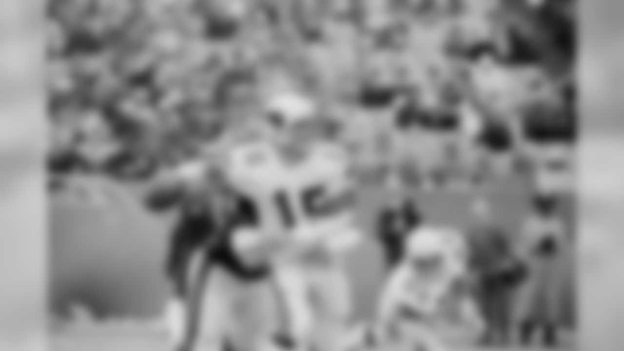 1982: Cardinals QB Neil Lomax is wrapped up by James Scott