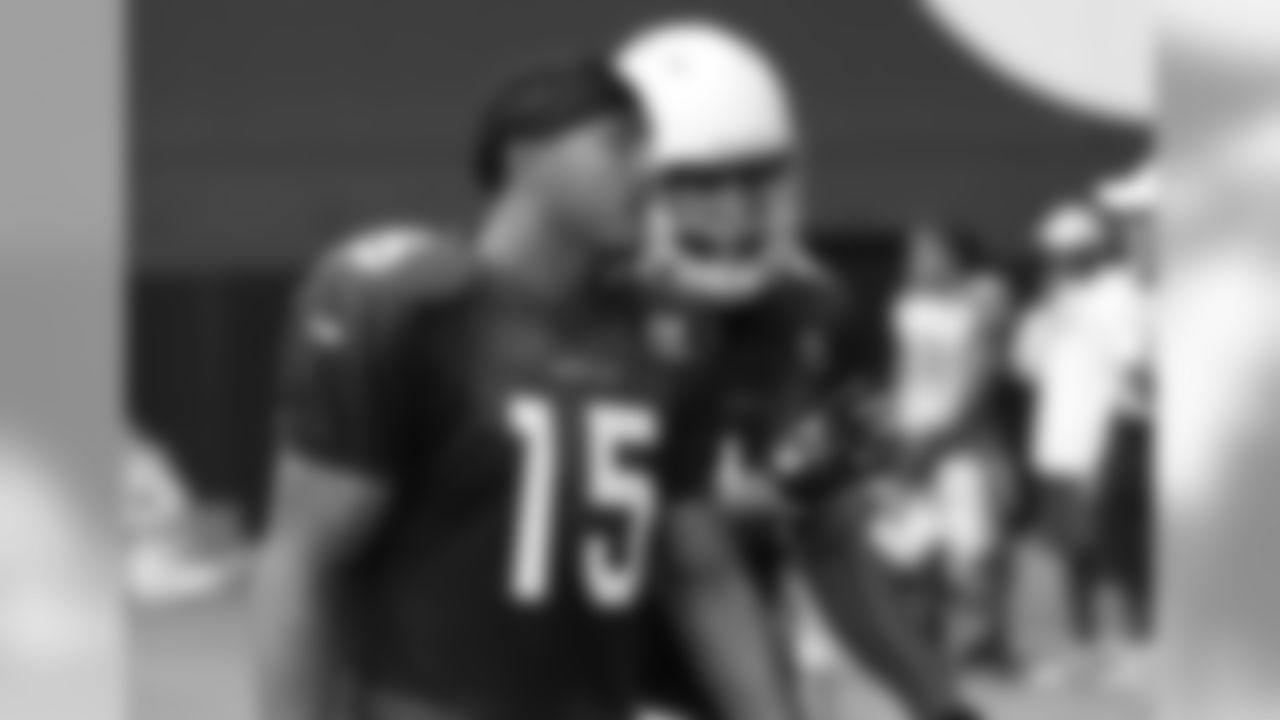 WR Michael Floyd (left) talks to WR Larry Fitzgerald