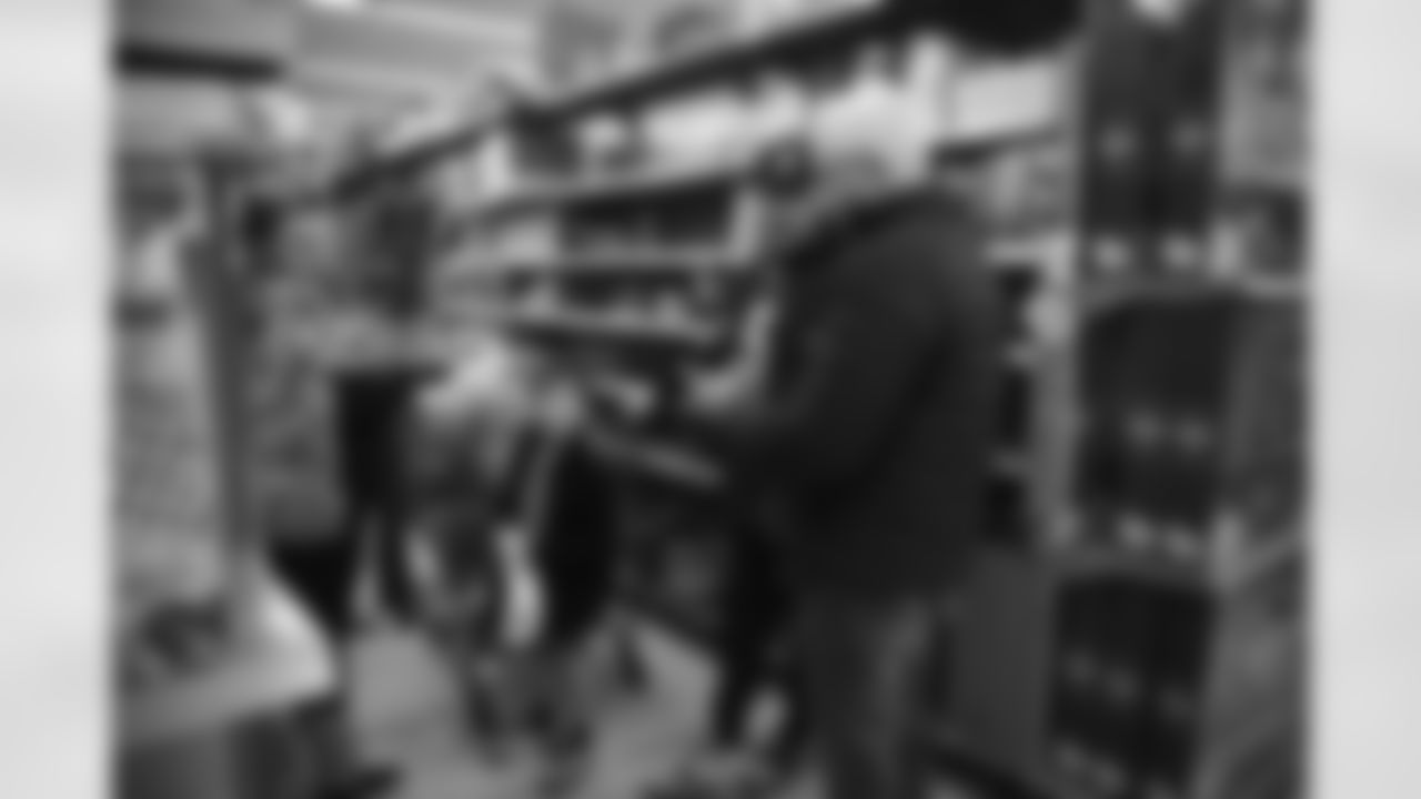 The Arizona Cardinals participate in Shop With A Jock with Desert Financial Credit Union at Walmart on Tuesday, December 13, 2022 in Tempe, AZ.