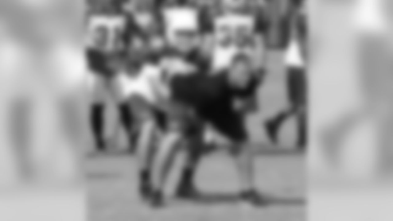QB John Skelton takes a snap from coach John Lott