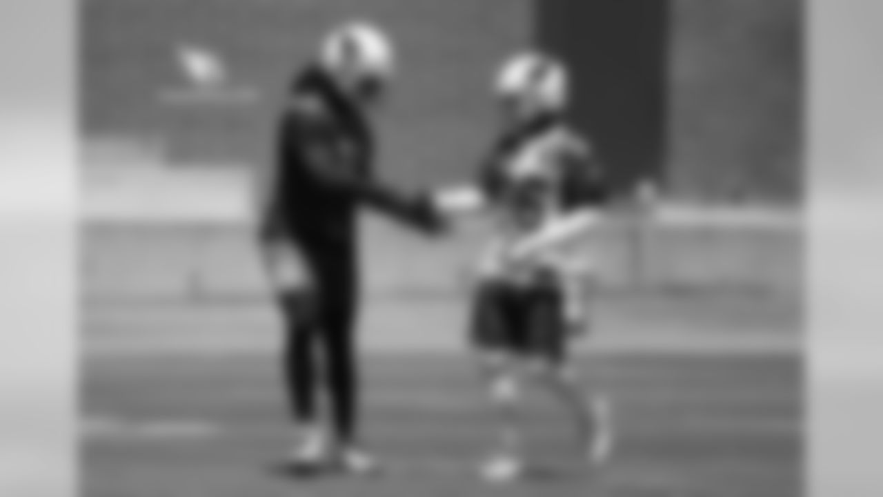 WR Larry Fitzgerald (left) shakes hands with S Budda Baker