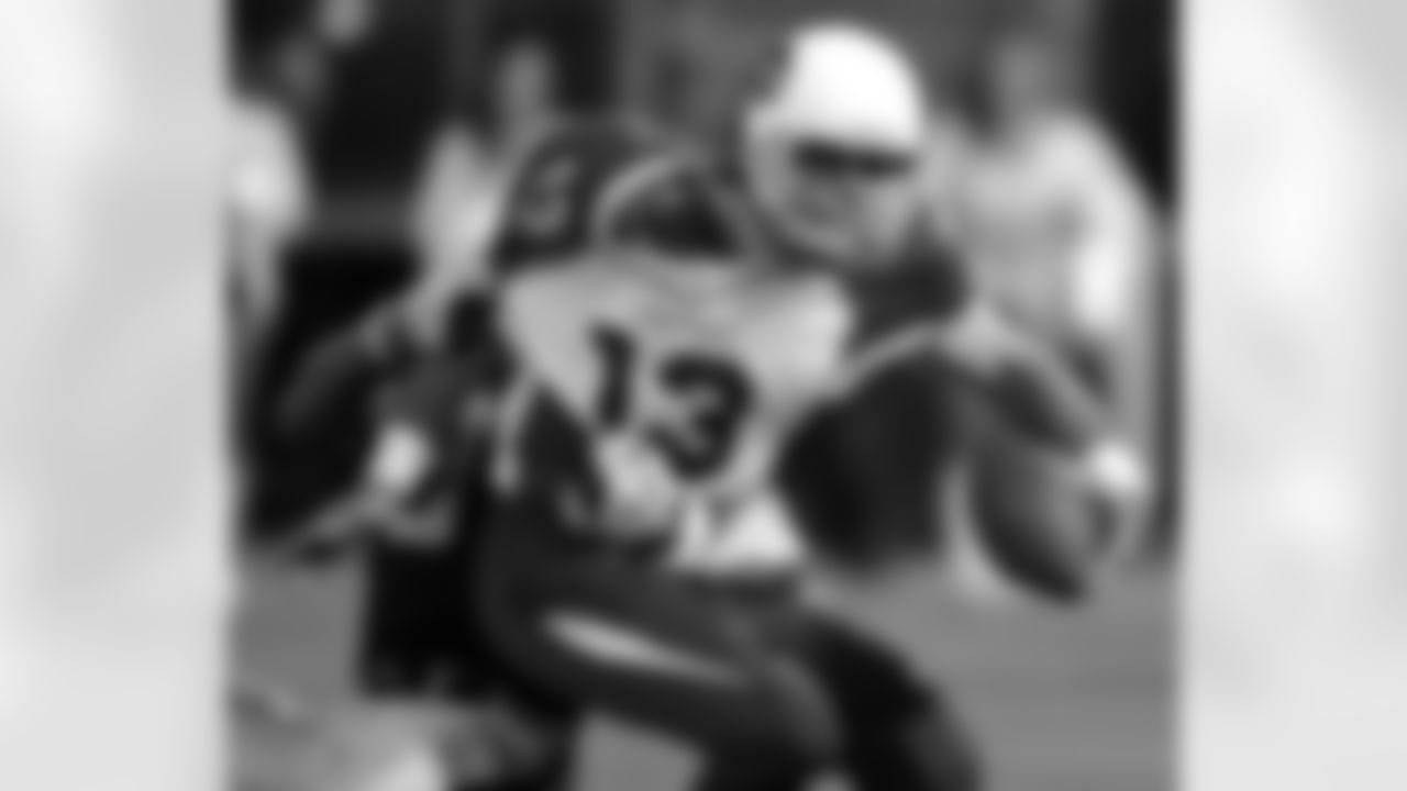 QB Kurt Warner is sacked by Raiders LB Grant Irons in 2005