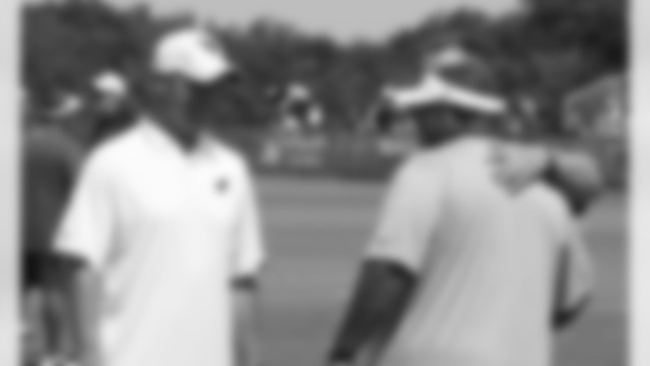 Coaches Ken Whisenhunt and Romeo Crennel