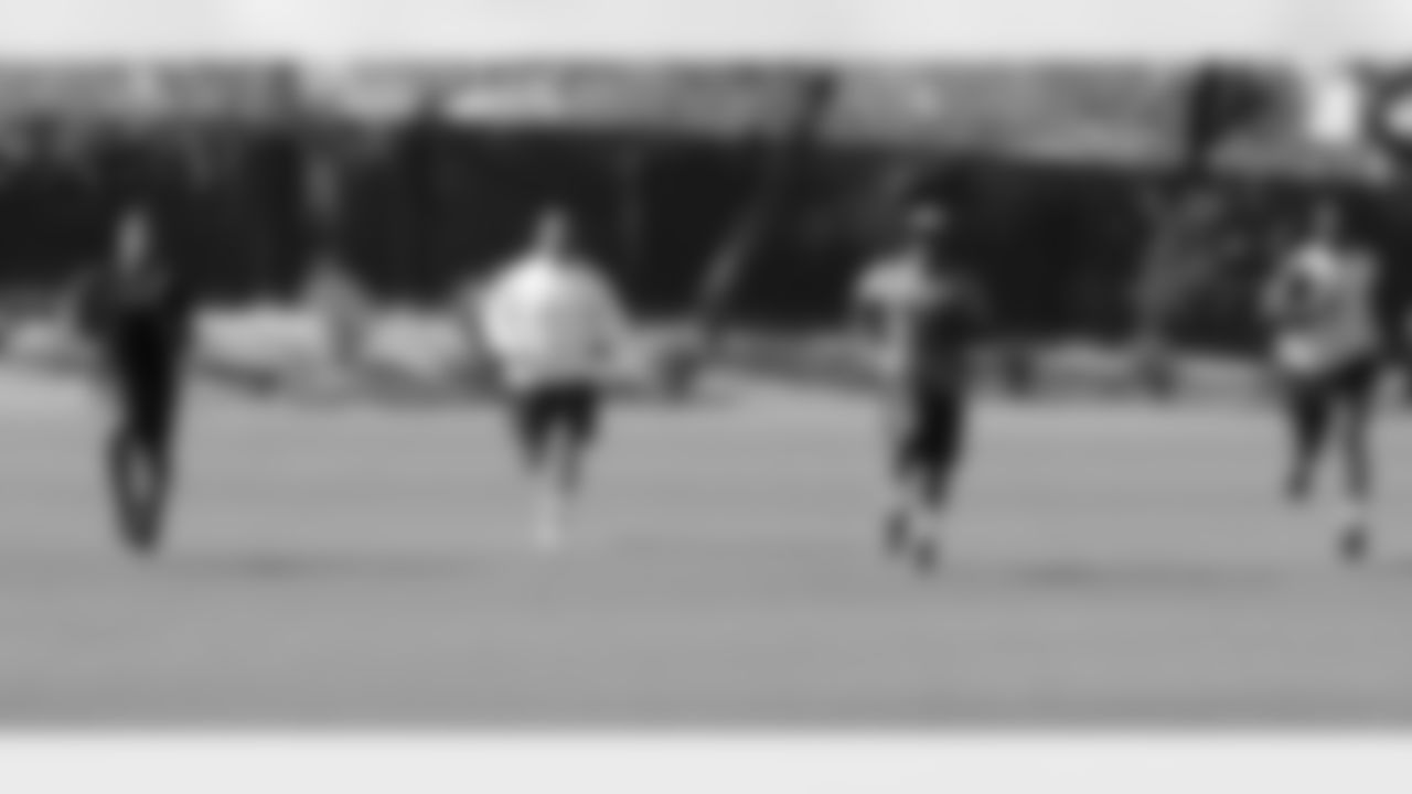 From left: LB Kevin Minter, LB Matt Shaugnessy, LB Adrian Tracy and LB Alex Okafor run on the field.