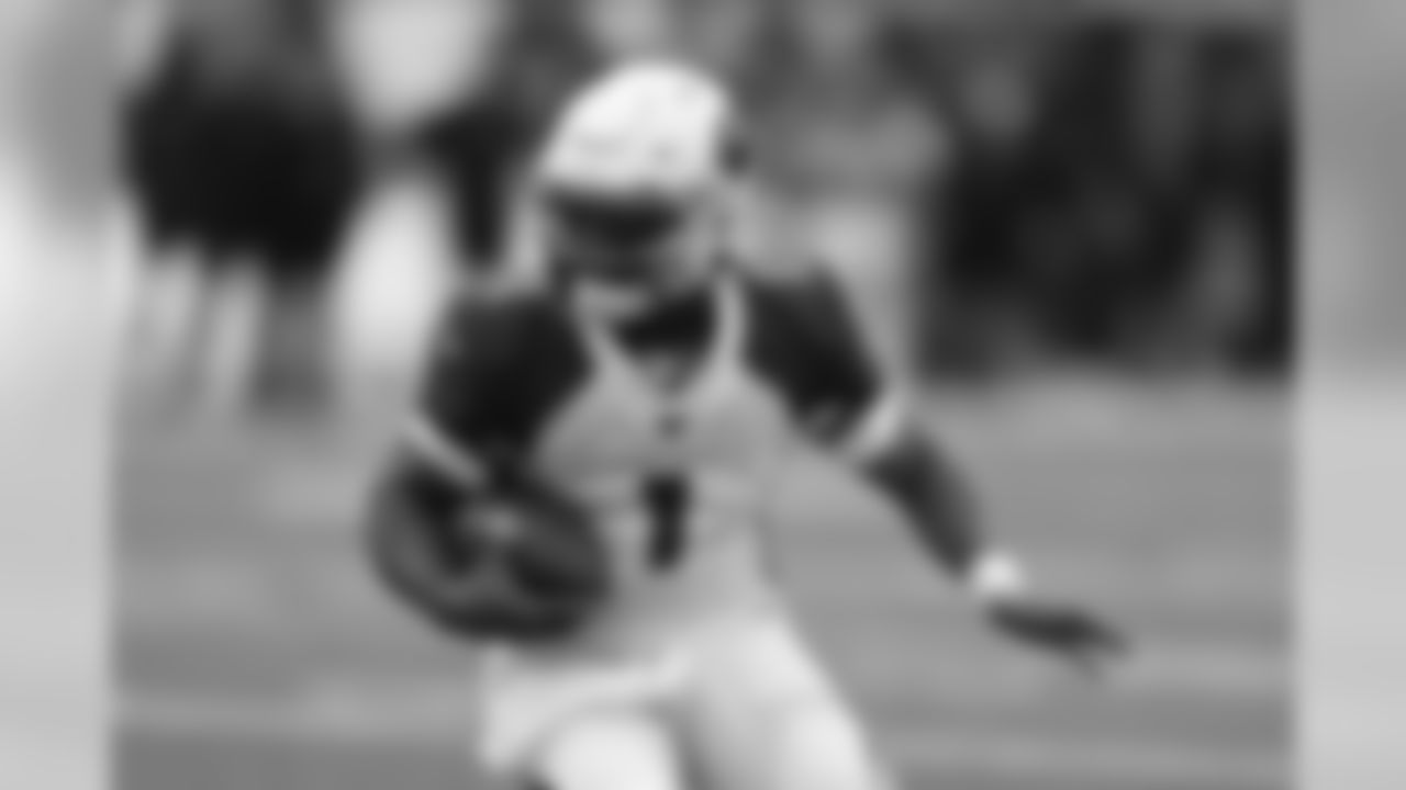 Cardinals quarterback Kyler Murray runs the ball in the first half against the Bengals.