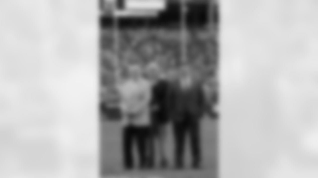 Hall of Famers Charley Trippi (left) and Larry Wilson with Cardinals owner Michael Bidwill.