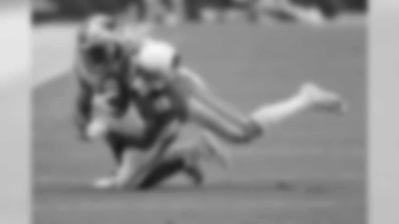 Cardinals wide receiver KeeSean Johnson (19) makes the catch as Panthers outside linebacker Shaq Thompson (54) makes the tackle during the second half.