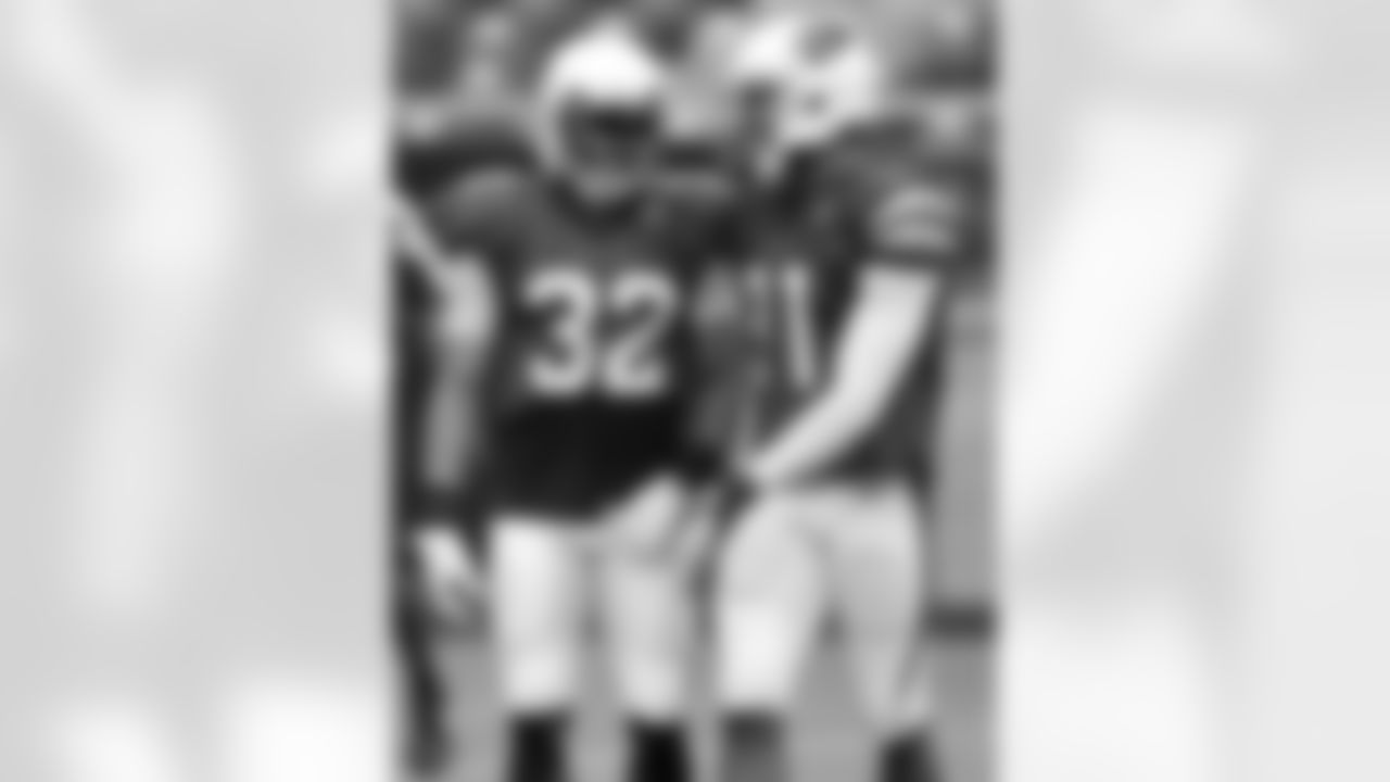 Bethel (right) with S Tyrann Mathieu in training camp last year