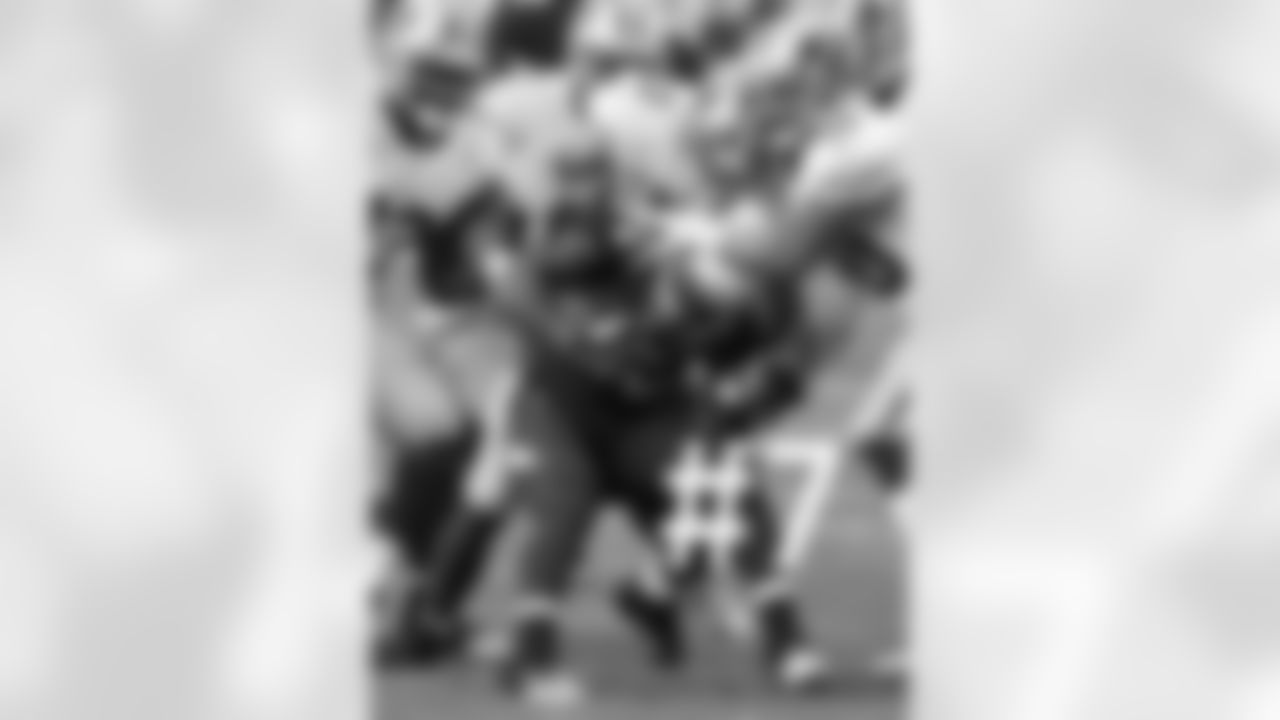 KR Javier Arenas is tackled by several 49ers.