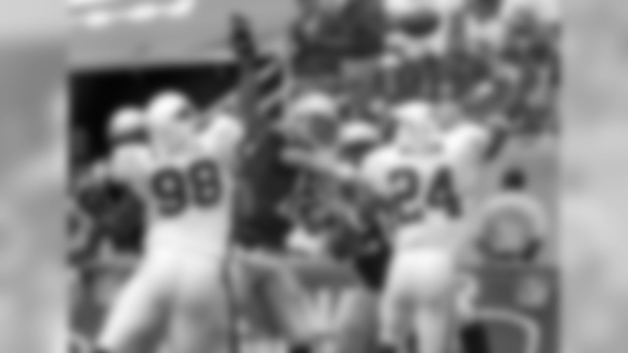 2004 - DT Russell Davis and S Adrian Wilson pressure Tom Brady