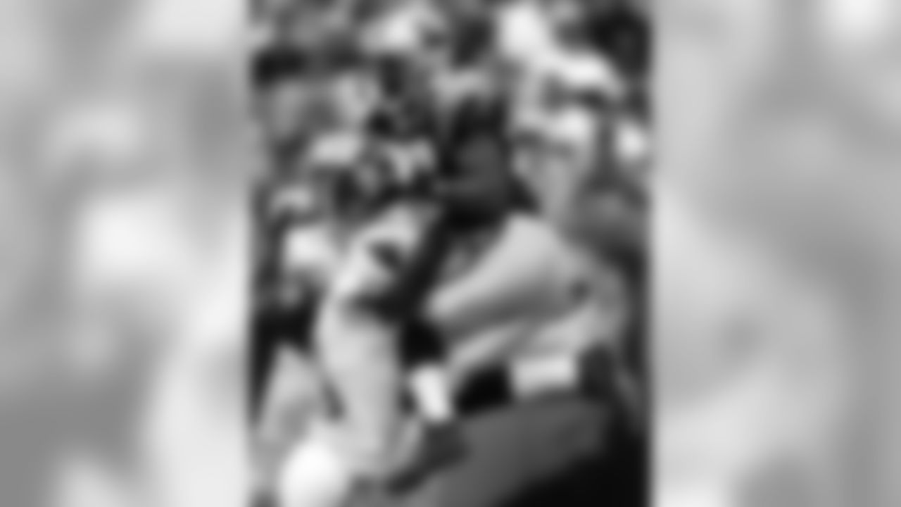 Renaldo Hill puts a hit on Muhsin Muhammad in 2004