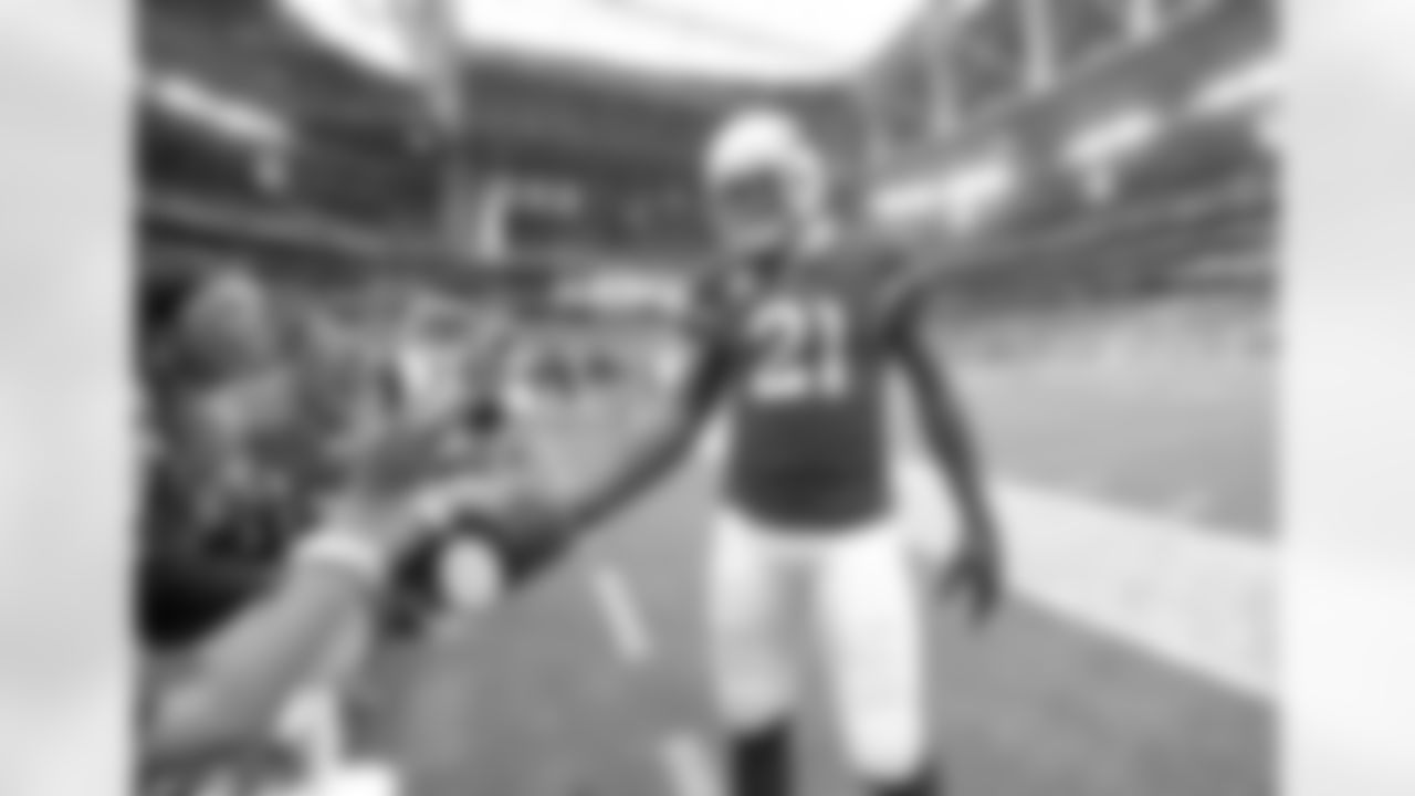 CB Patrick Peterson gives a ball to a fan