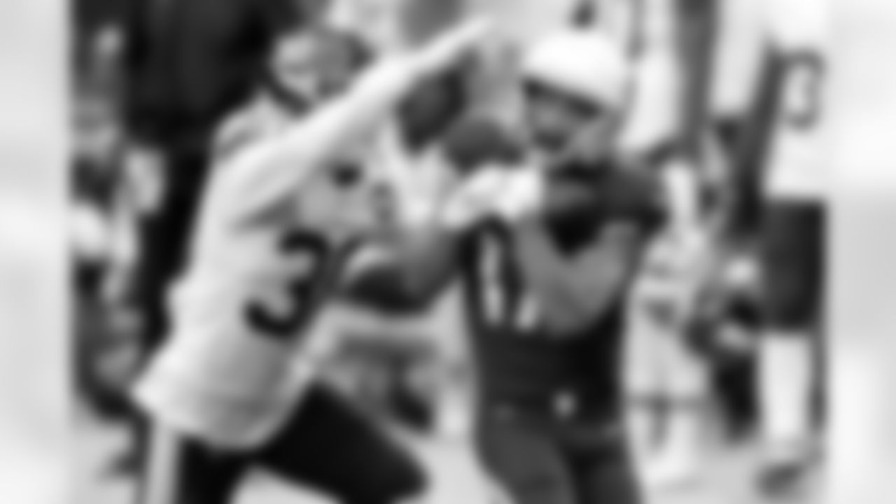 Arizona Cardinals wide receiver Andy Isabella (17) pulls in a pass as Washington Football Team free safety Troy Apke (30) defends.