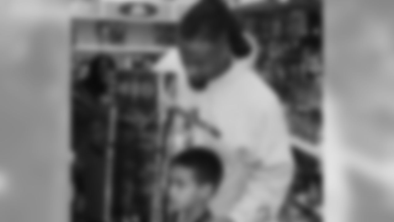 Darnell Dockett checks out a boy's new toy