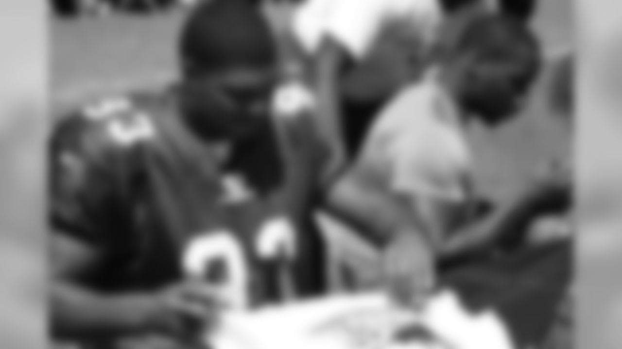 Calais Campbell signs autographs