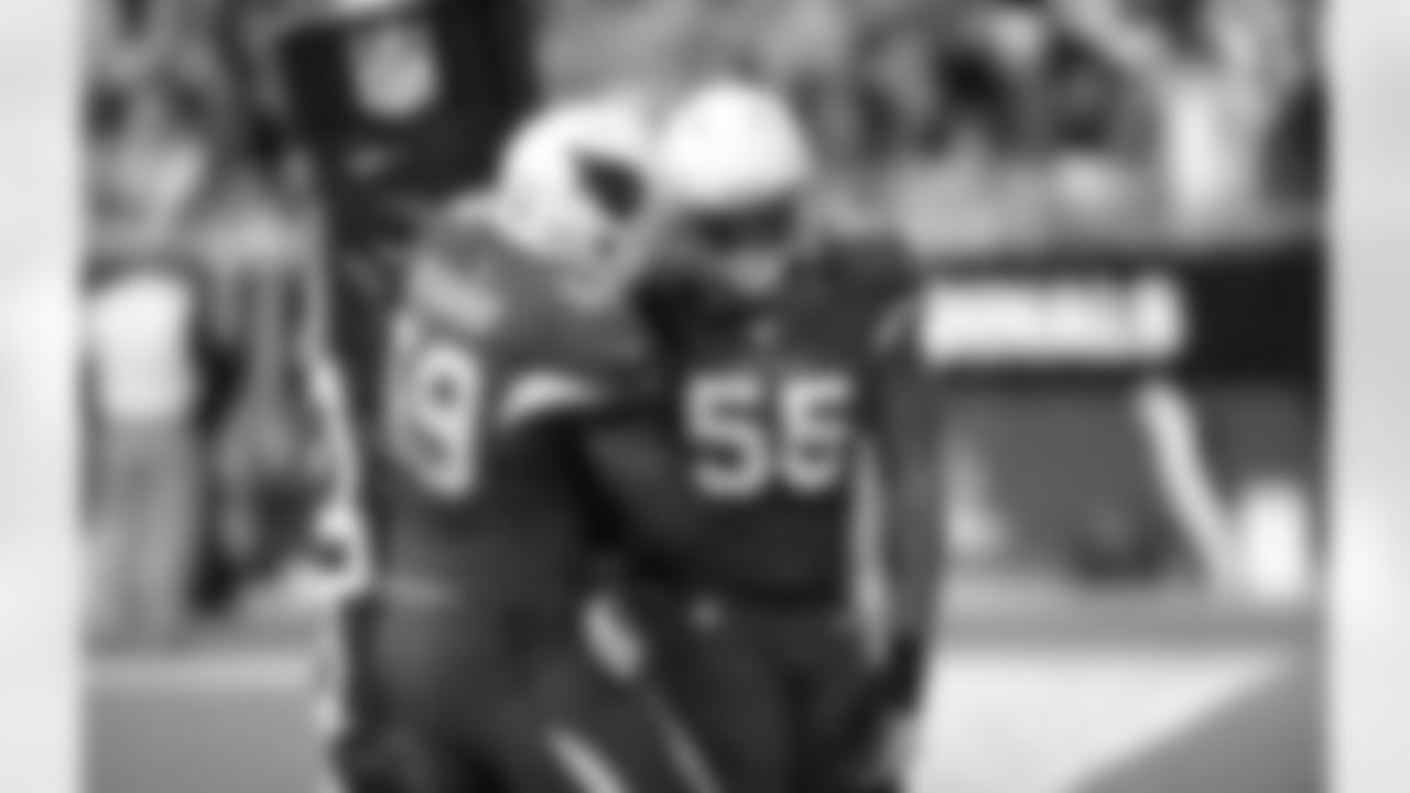 LB Marcus Benard and LB John Abraham